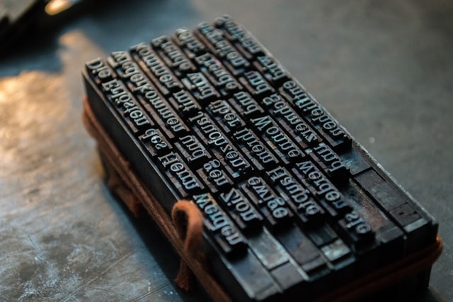 A letter press showing six rows of letters